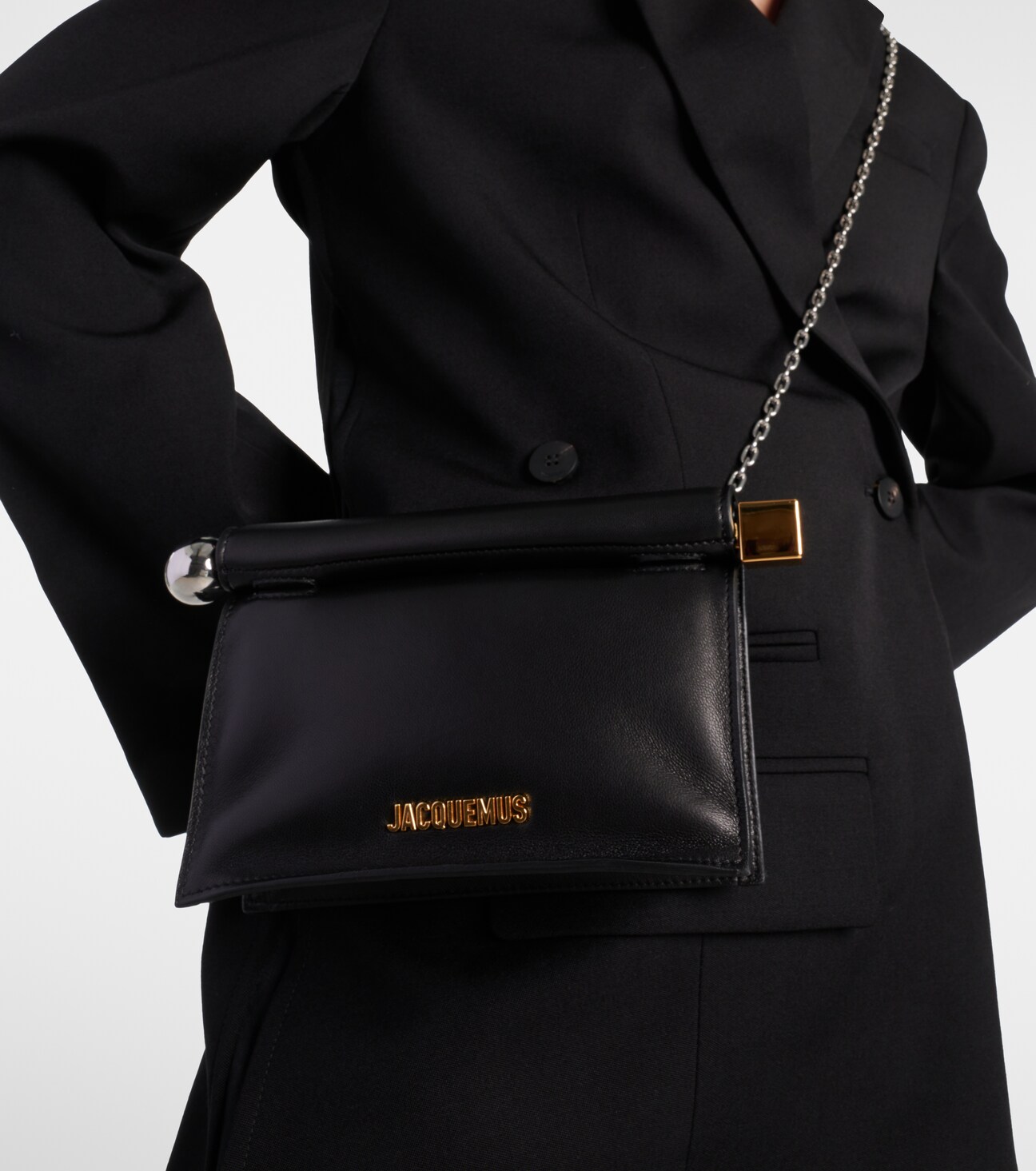 Worn crossbody over tailoring