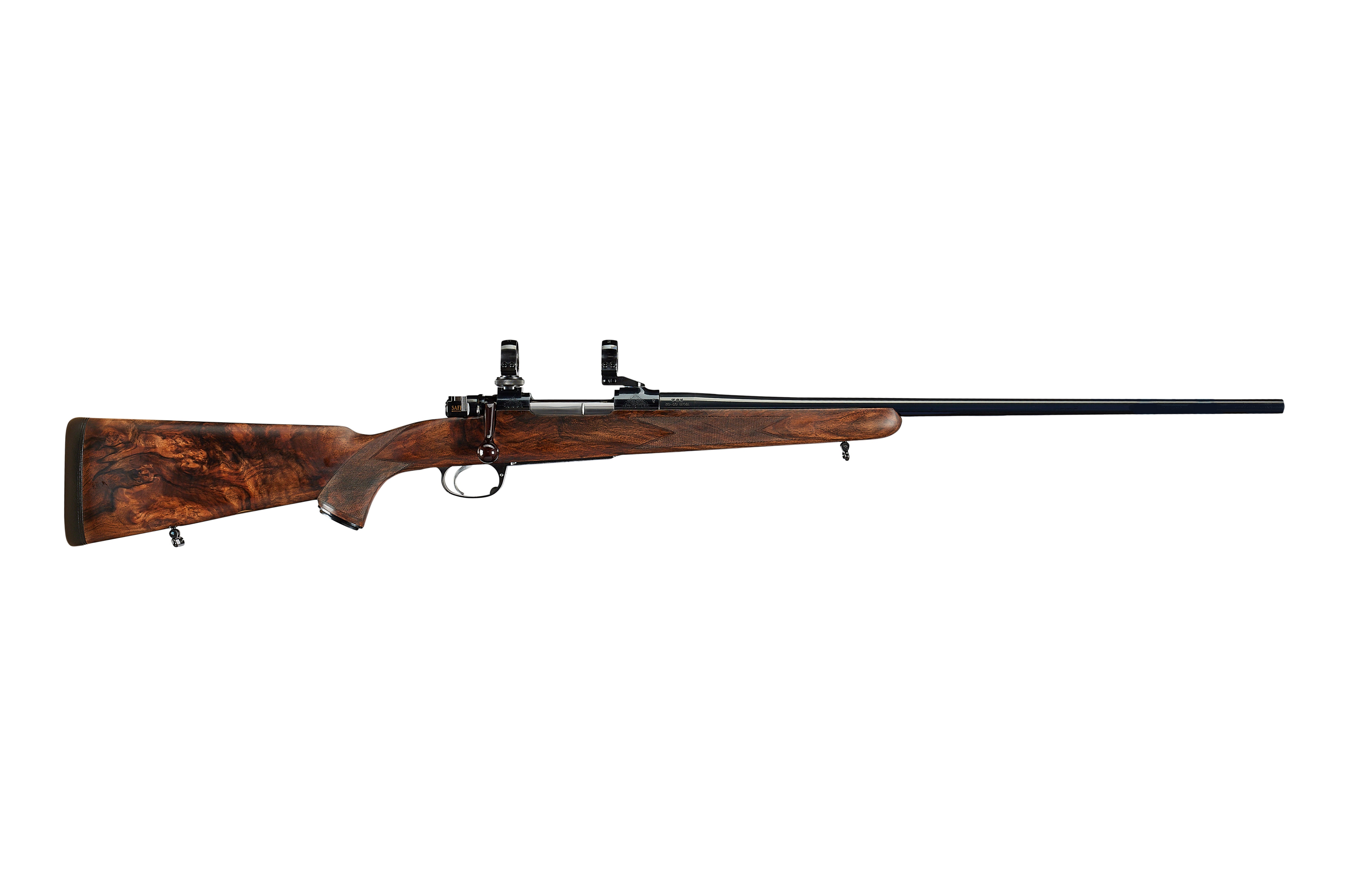 Left profile showing the long barrel and bridge mounts