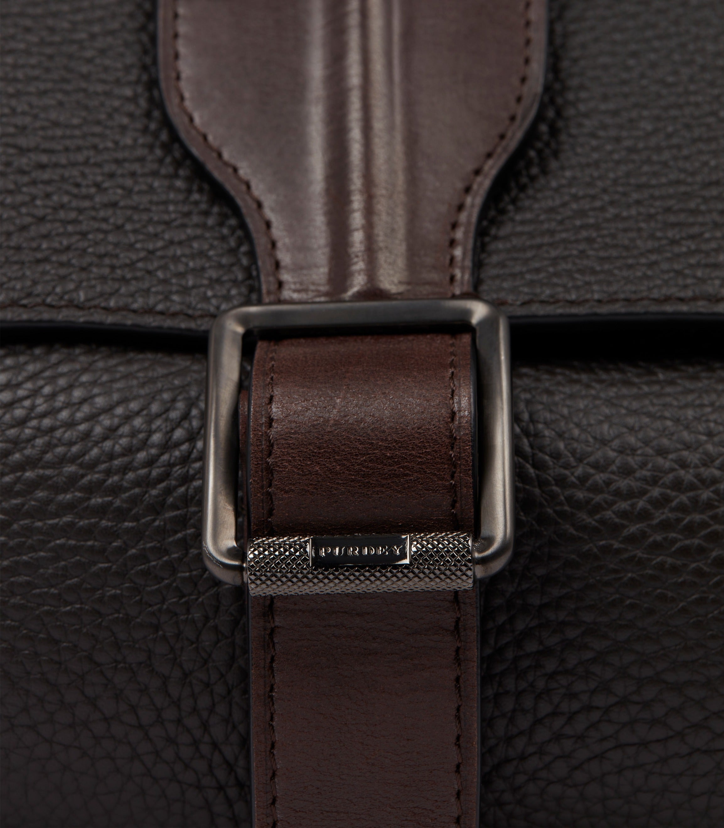 Close-up of the bombe leather strap detail