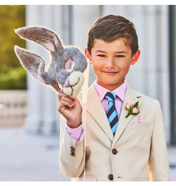Styled image showing the blazer worn with a tie and boutonniere