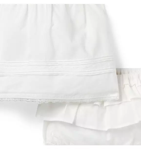 Close view of the pintucks, hem stitching, and lace edge