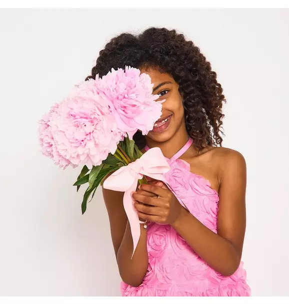 Styled image showing the dress worn for an occasion