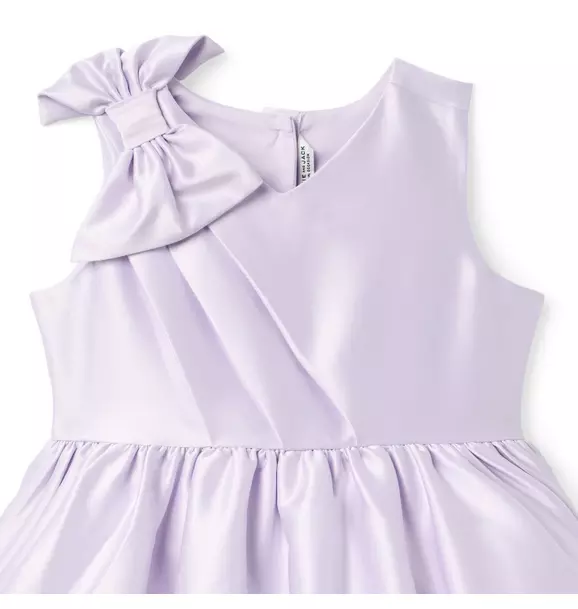 Close view of the satin bodice and bow detail