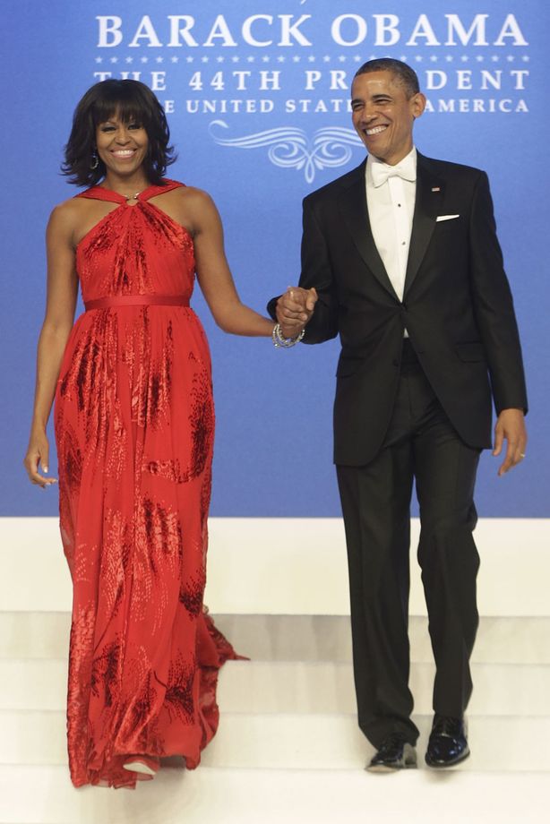 Full-length press image of the ruby chiffon gown