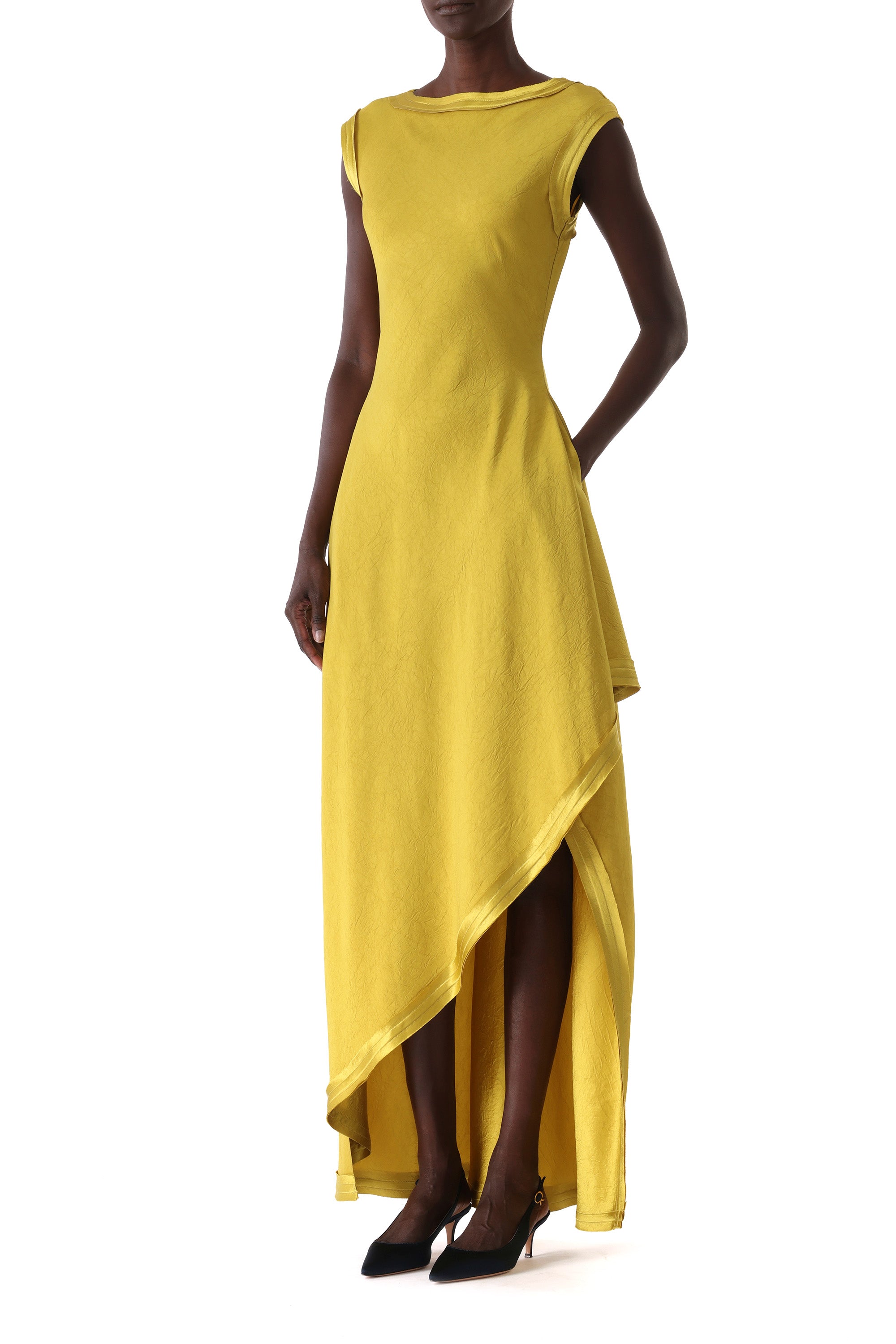 Side view showing the asymmetric fall of the skirt