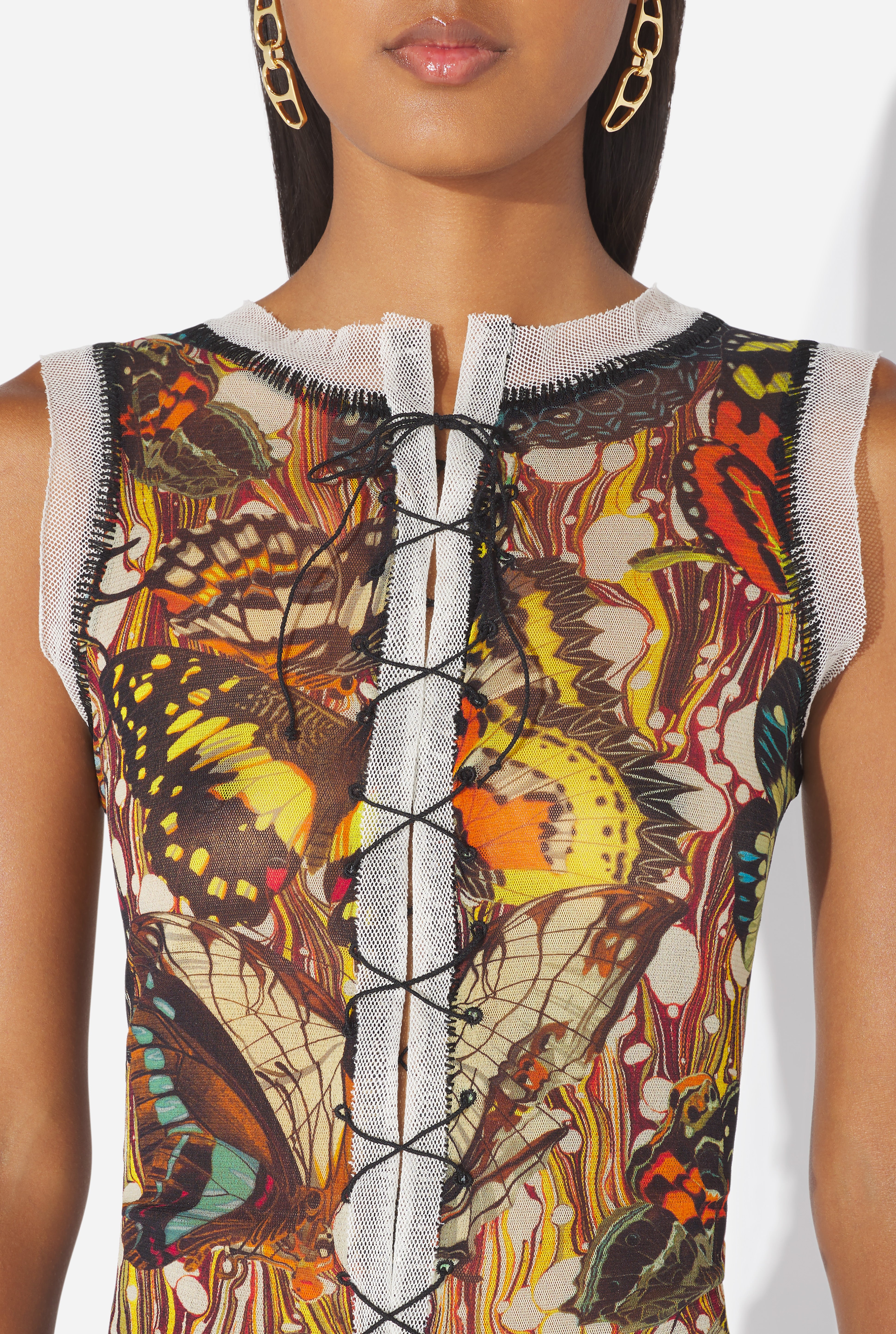 Upper-body detail of the butterfly motif
