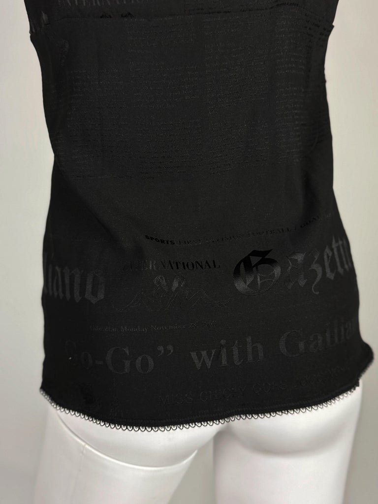 Hem detail with the Gazette text ghosting through the black ground
