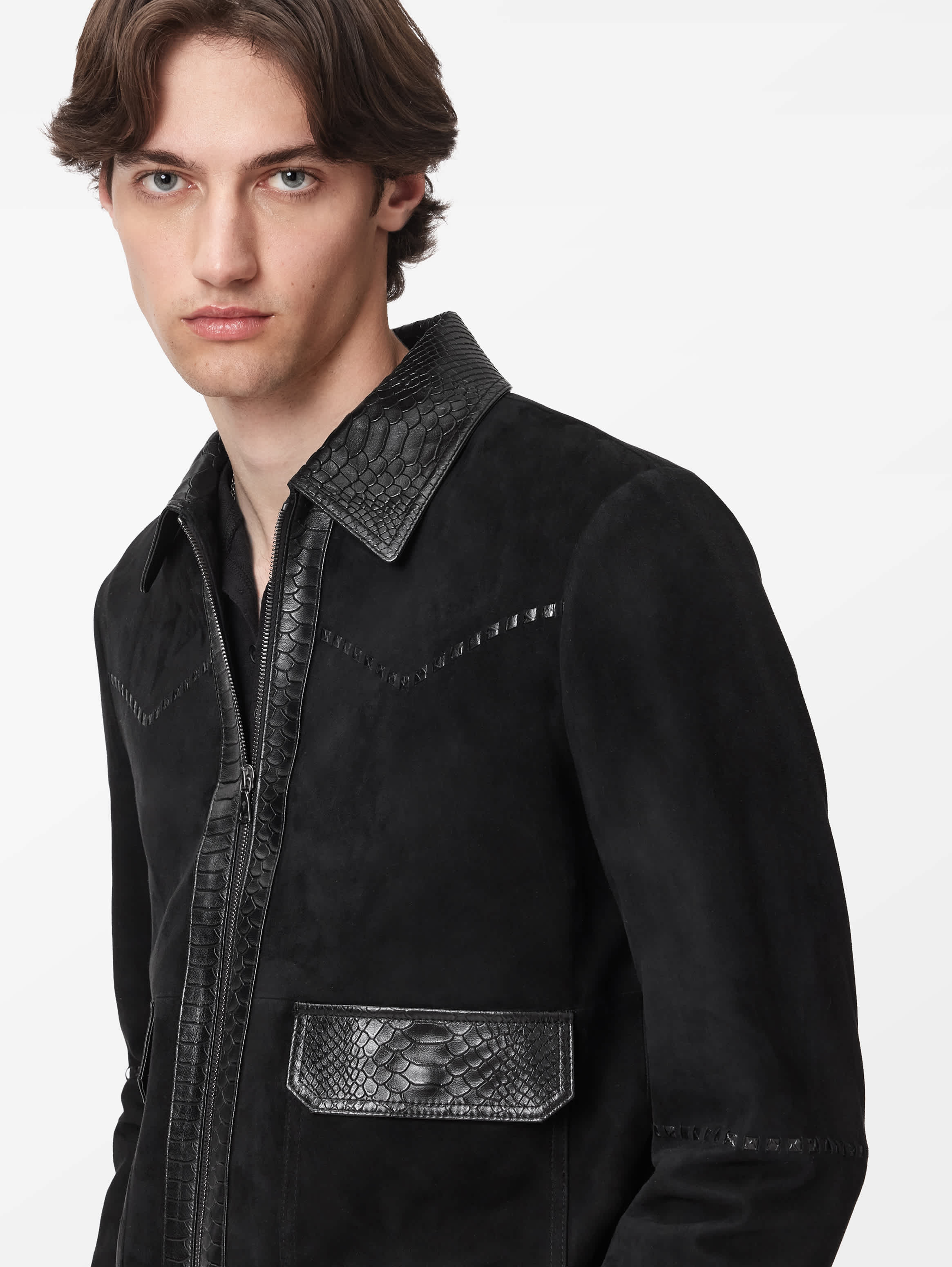 Close crop of the croc-embossed collar and zip placket