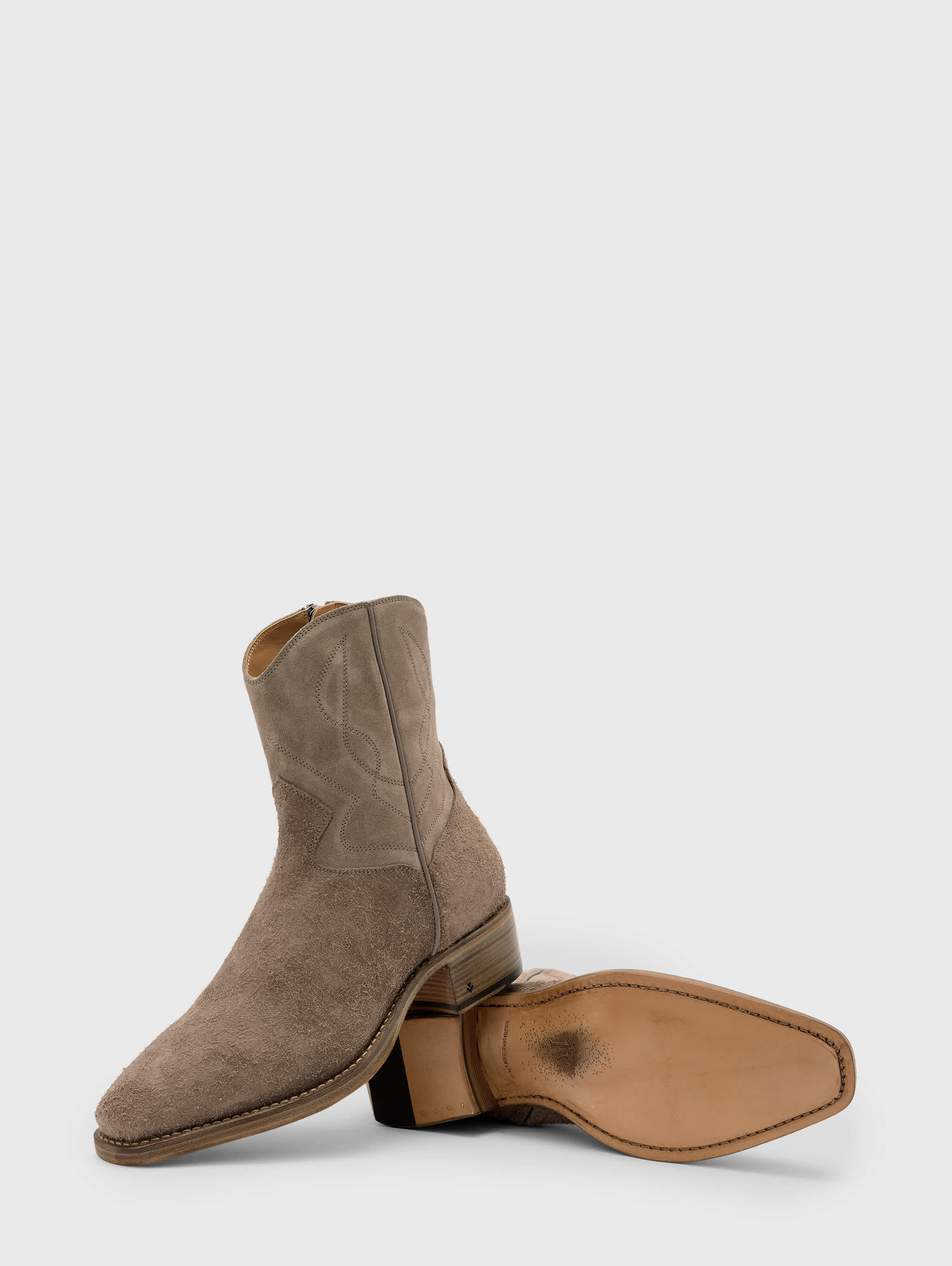 Profile and sole showing the hand-stained leather base