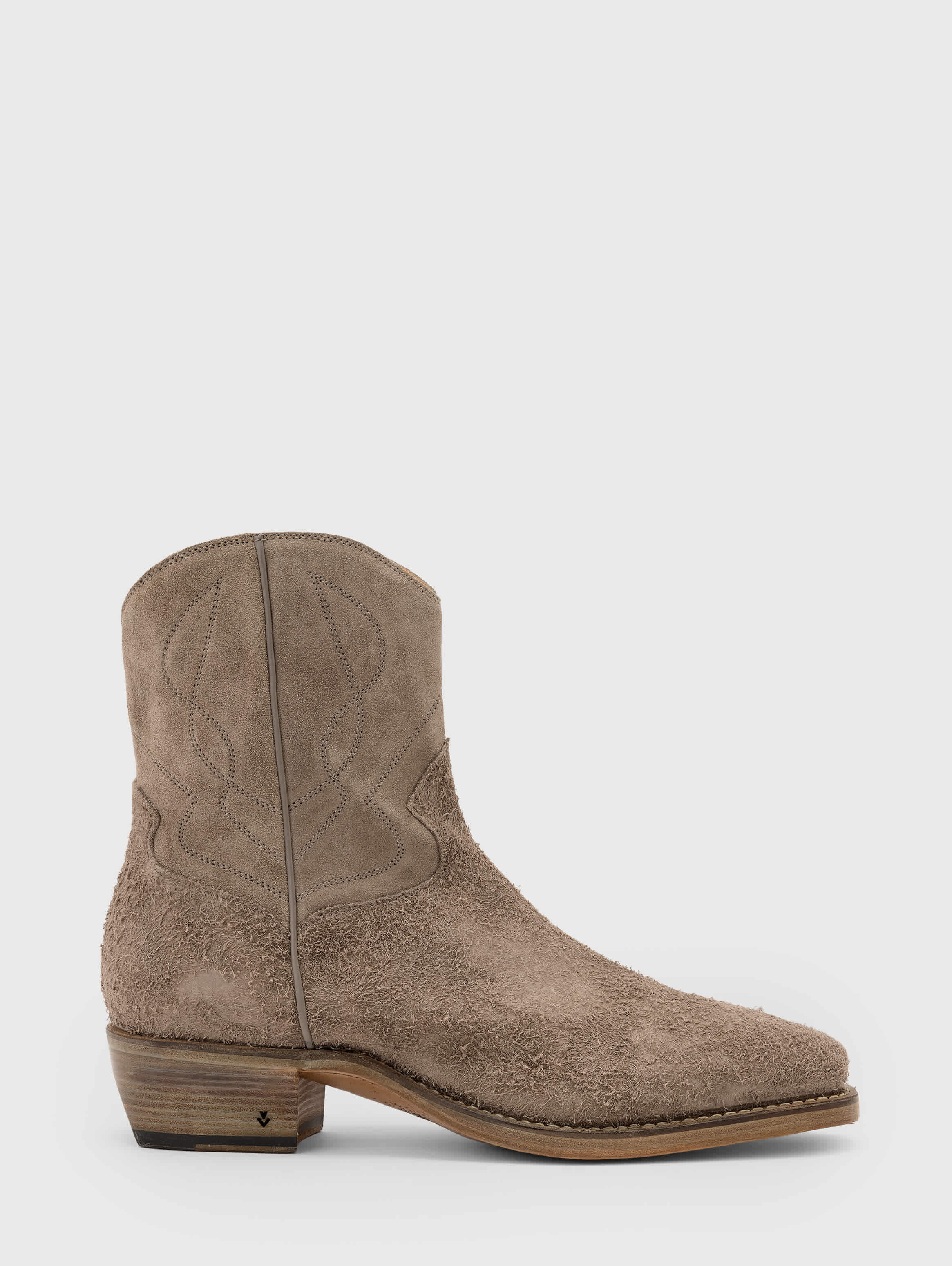 Side profile emphasizing the pointed toe and stacked heel