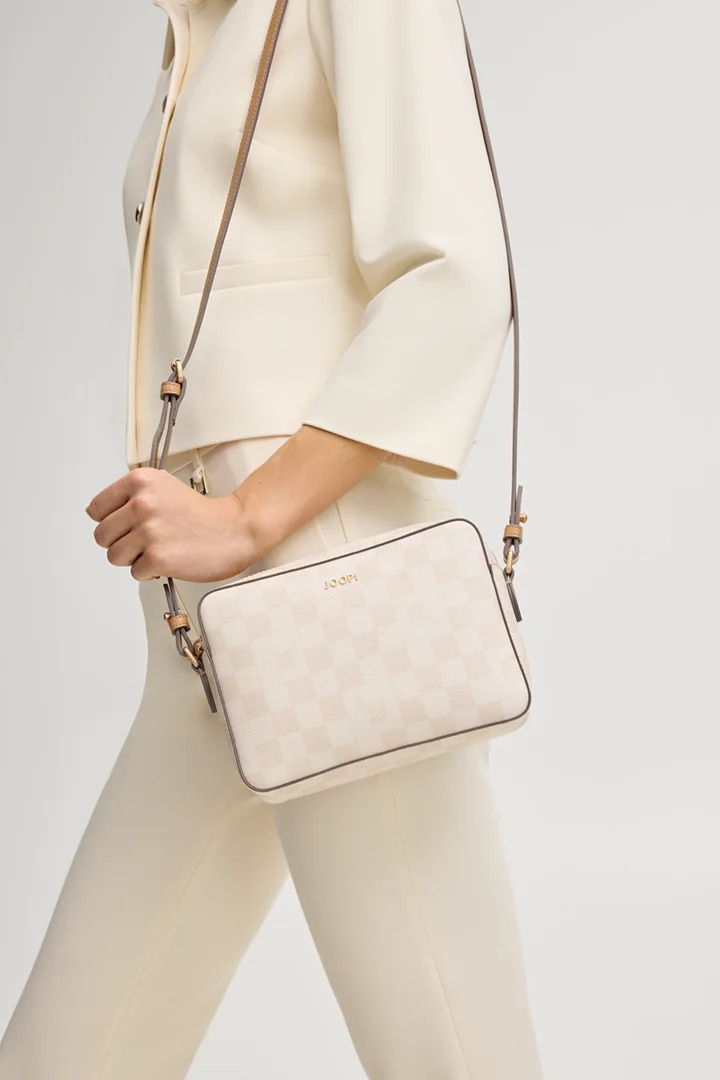 Crossbody styling with the long belt-style strap