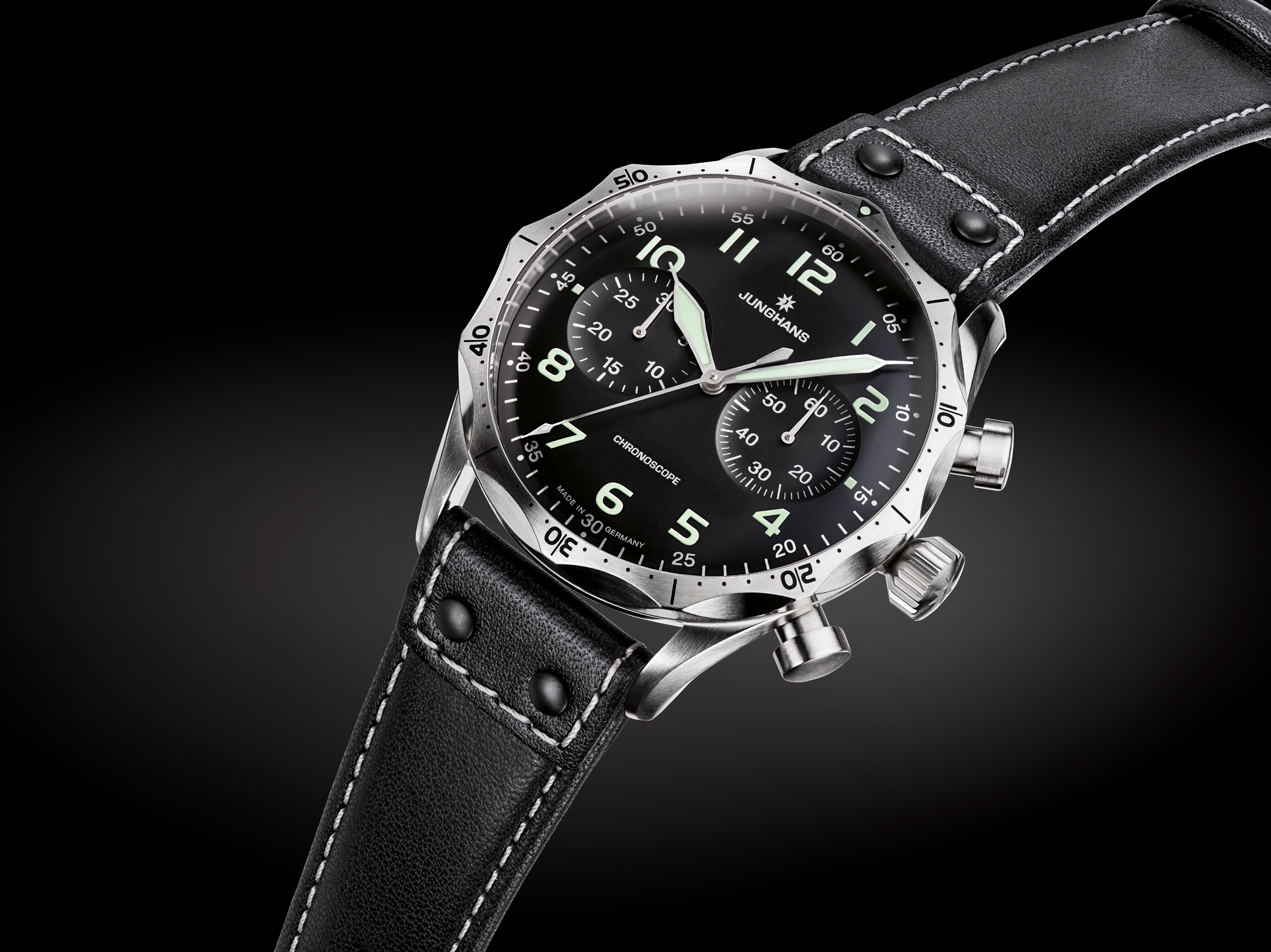 Studio angle emphasizing the riveted leather strap and aviation dial