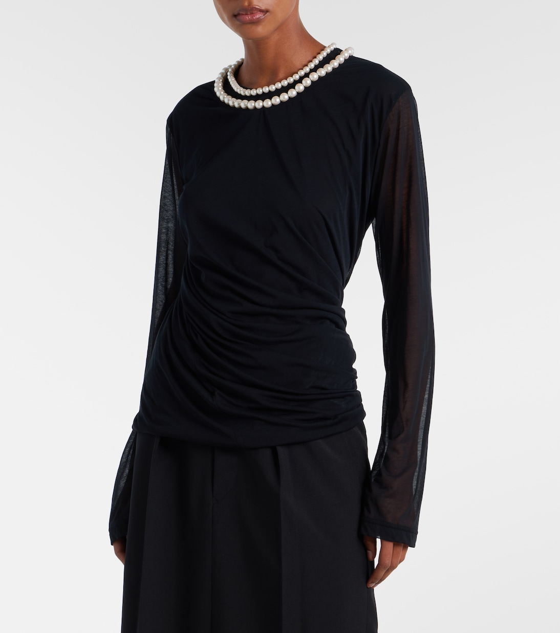 On-body view showing the long sleeves and body-skimming wrap.