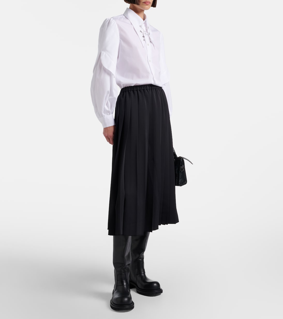 Full look showing the skirt’s easy midi proportion.