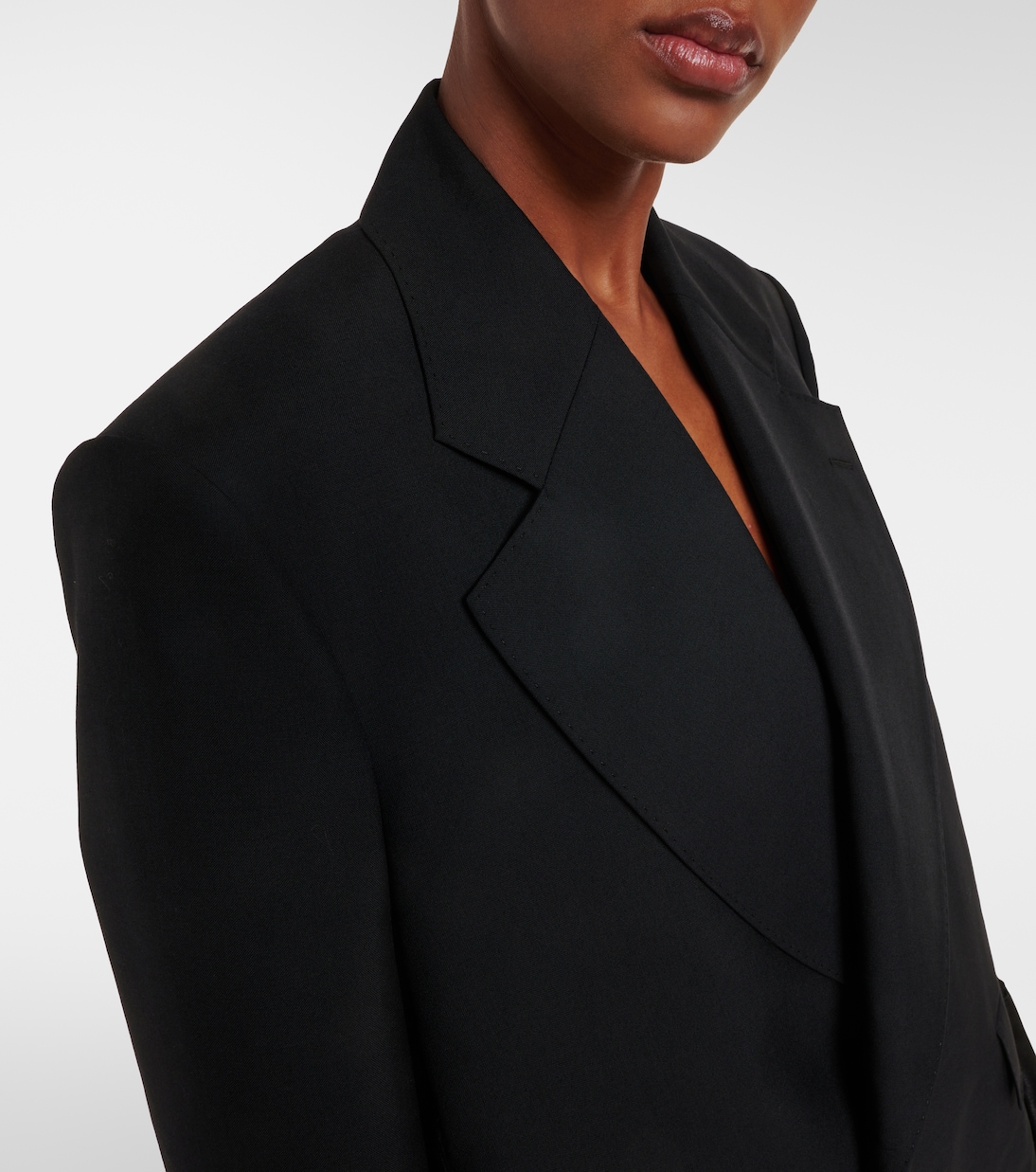 Close detail of the notch lapel and shoulder line.