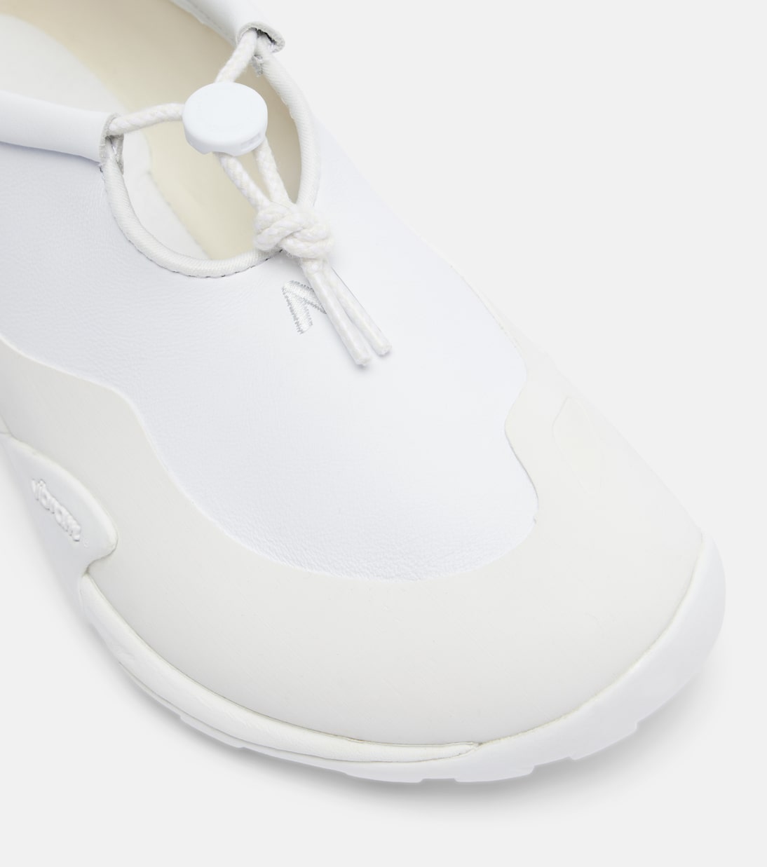 Close detail of the drawstring closure and toe shape.