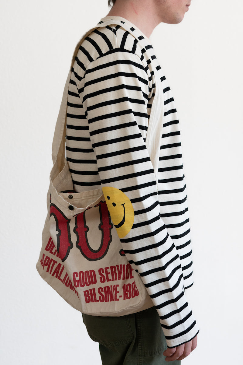 Sleeve detail with the smiley patch