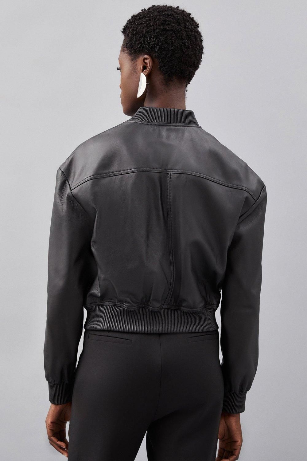 Styling shot showing the jacket over evening separates