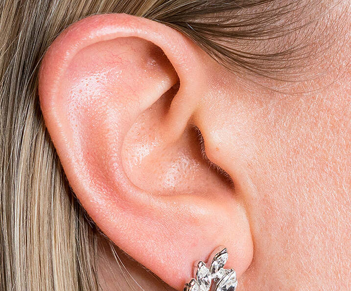 Top crop from the worn image focusing on the earlobe fit