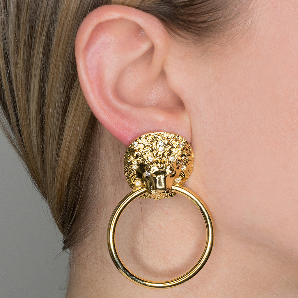 Worn view showing the earring's full drop and movement
