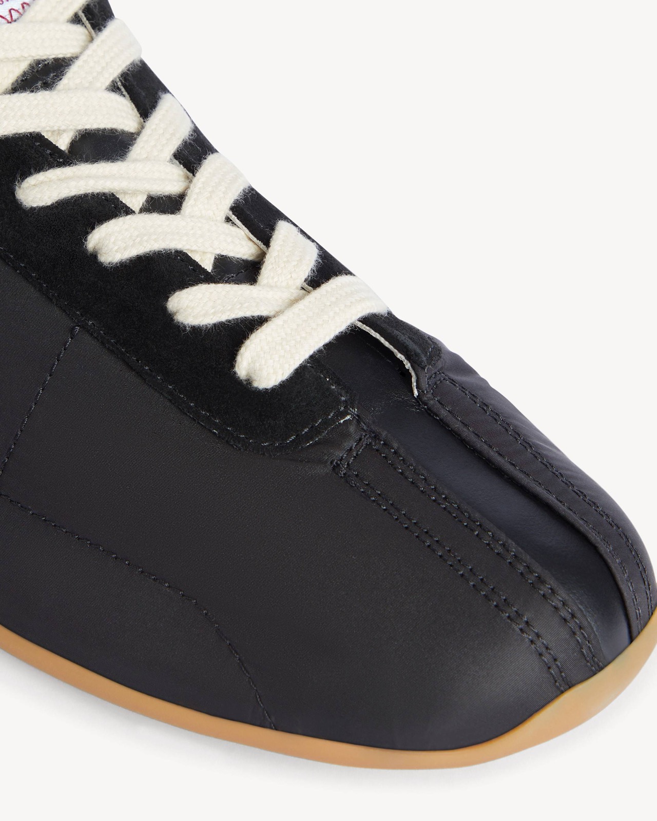 The laces, suede overlays and gum toe, close