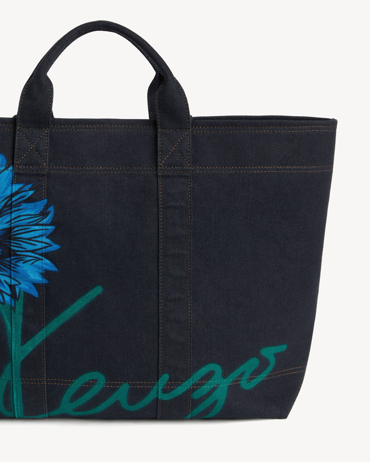 The printed bloom and hand-script Kenzo, close