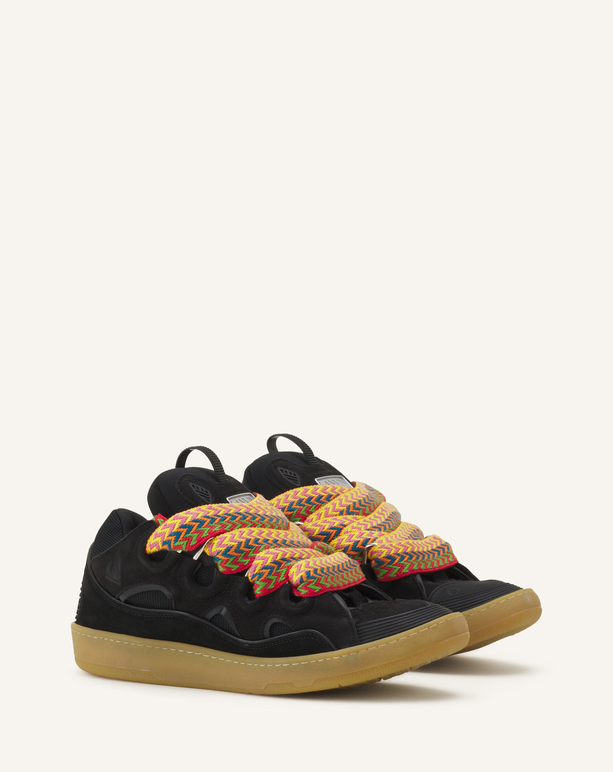 Three-quarter pair view — the exaggerated, padded proportions