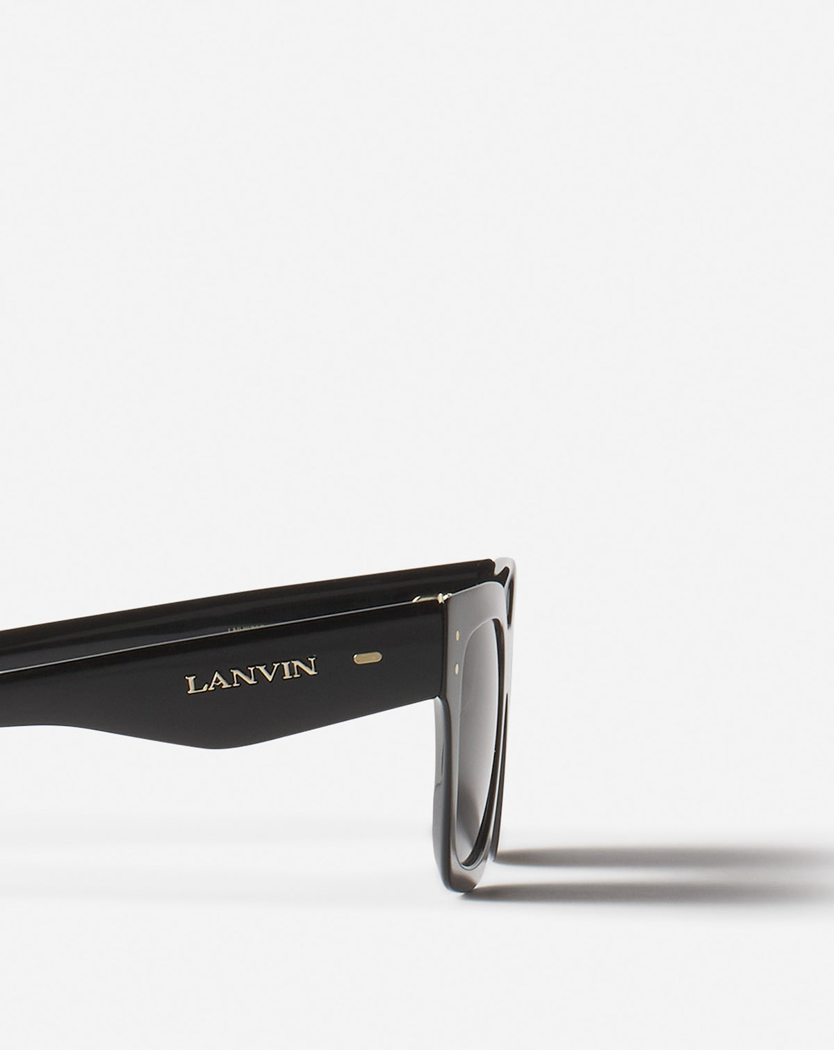 Temple detail — the LANVIN wordmark and rivets