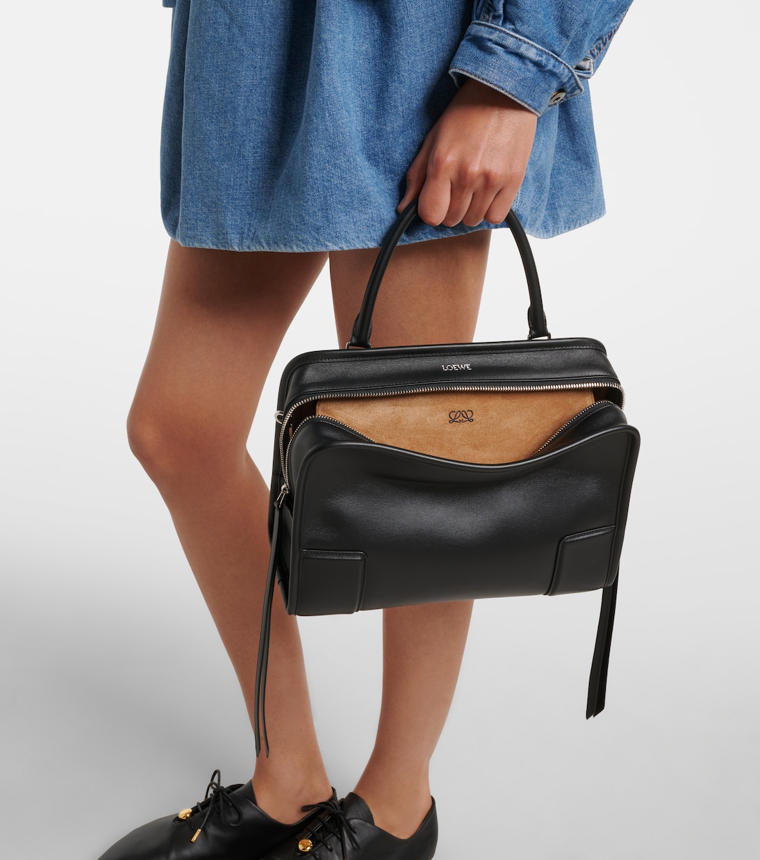The open-top zip reveals the suede interior with Anagram stamp