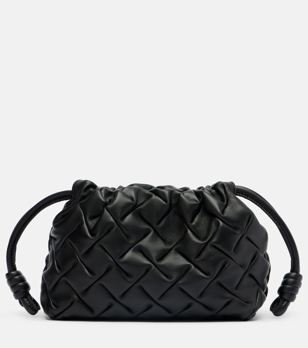 Flamenco Mini in black leather — the most minimal carry mode