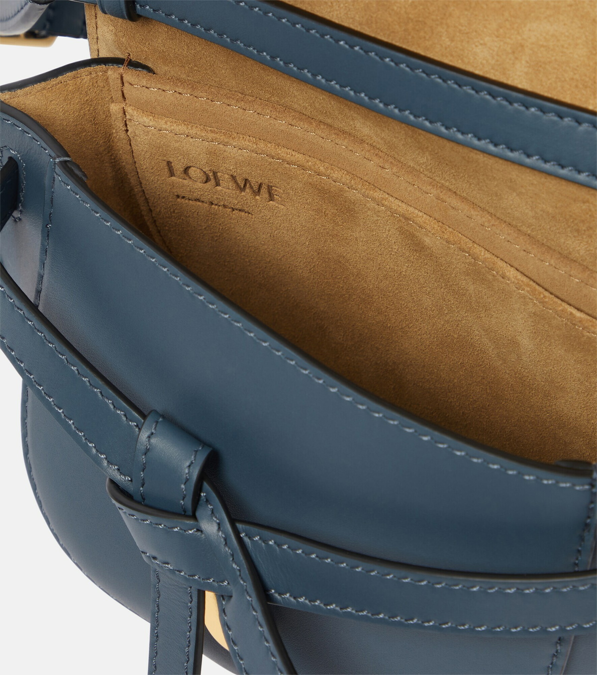 Saddle-bag silhouette with the D-ring and leather tie detail