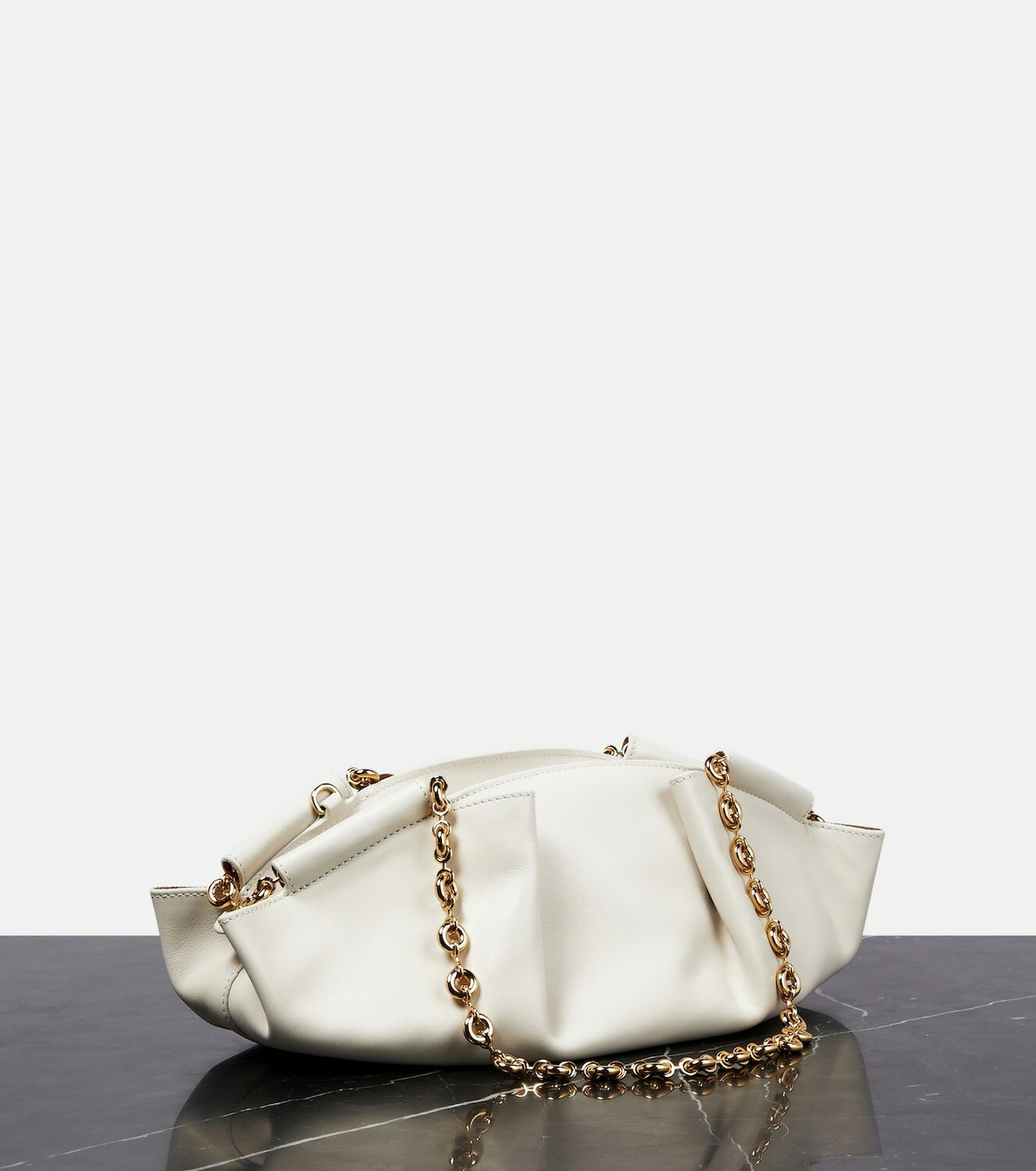 Flat interior view — the LOEWE wordmark and suede lining