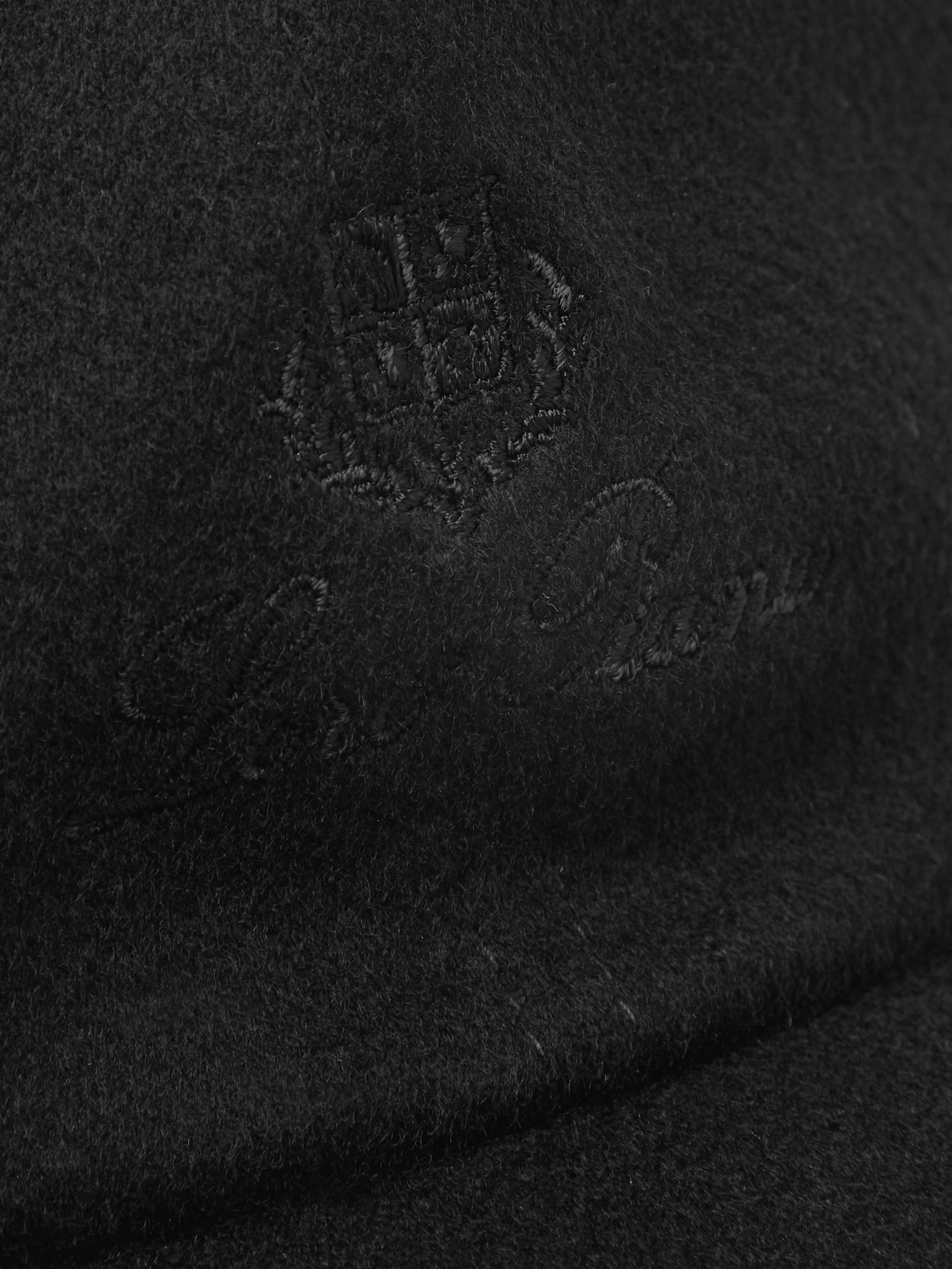 Detail of the tonal Loro Piana crest and signature embroidery