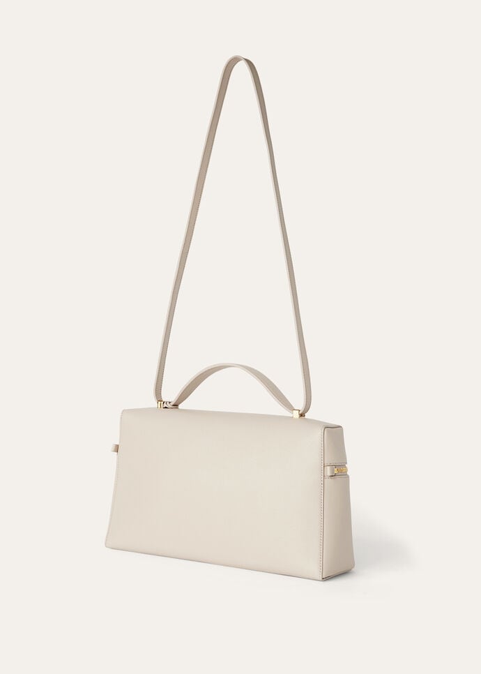 Three-quarter view of the boxy zip-around body