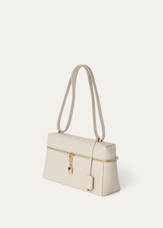 Profile showing the top handle and crossbody strap