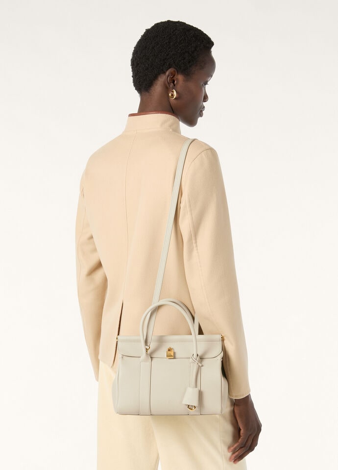 Worn with the adjustable crossbody strap