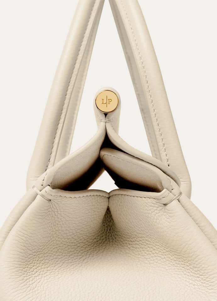 Detail of the padlock, key fob and grained calfskin