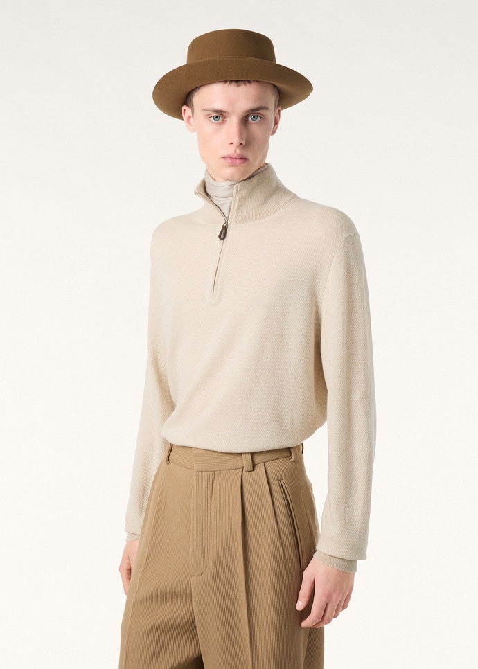 Detail of the leather zip puller and ribbed collar