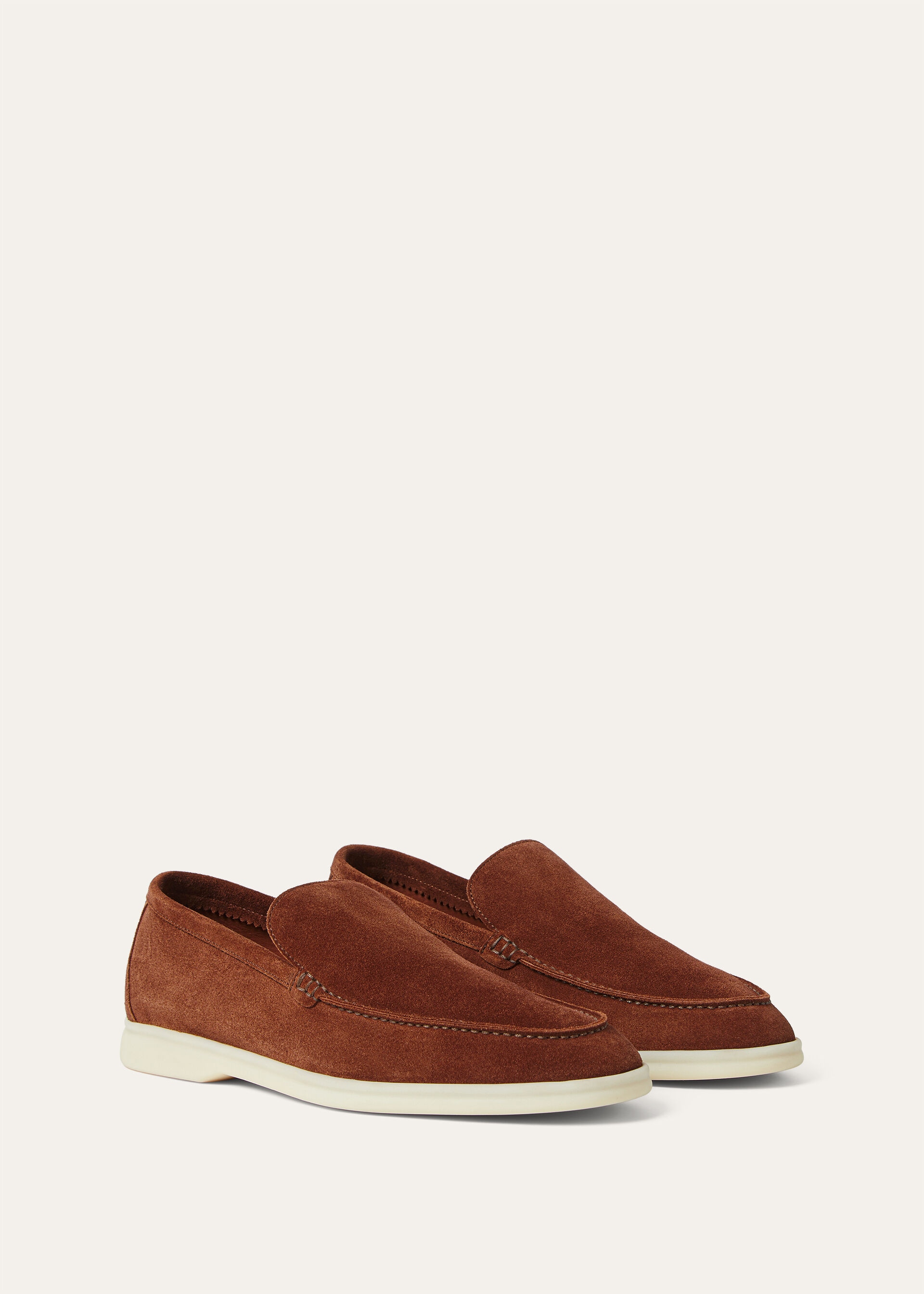 Pair, three-quarter view — the unlined moccasin construction