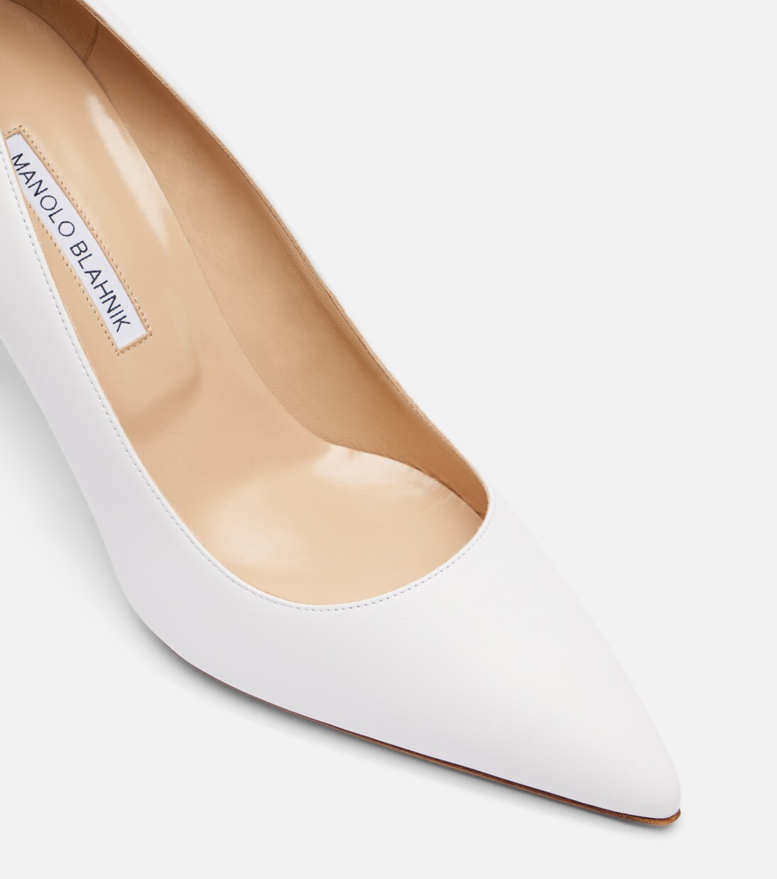White leather close-up with the same pared-back shape