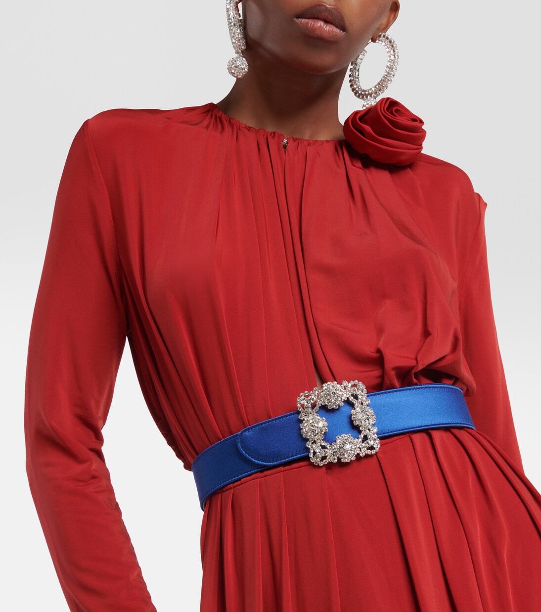 Blue belt styled at the waist on a red dress