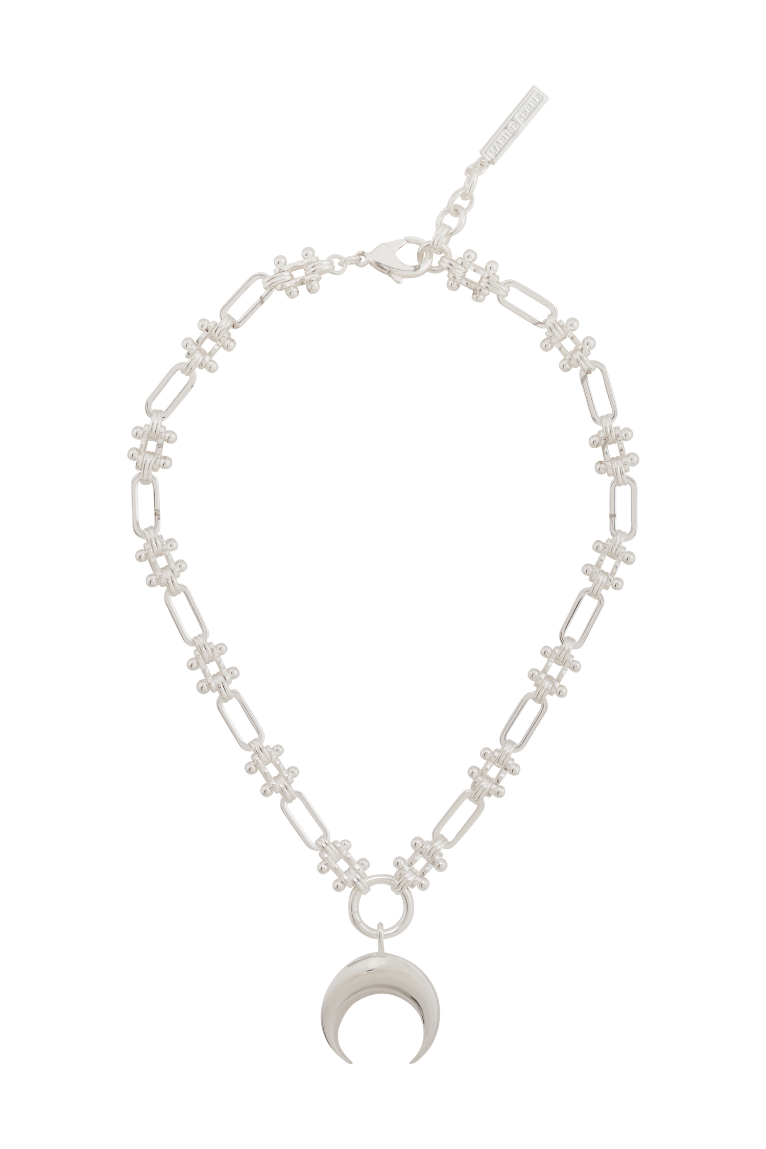 Flat-lay view of the chain and charm
