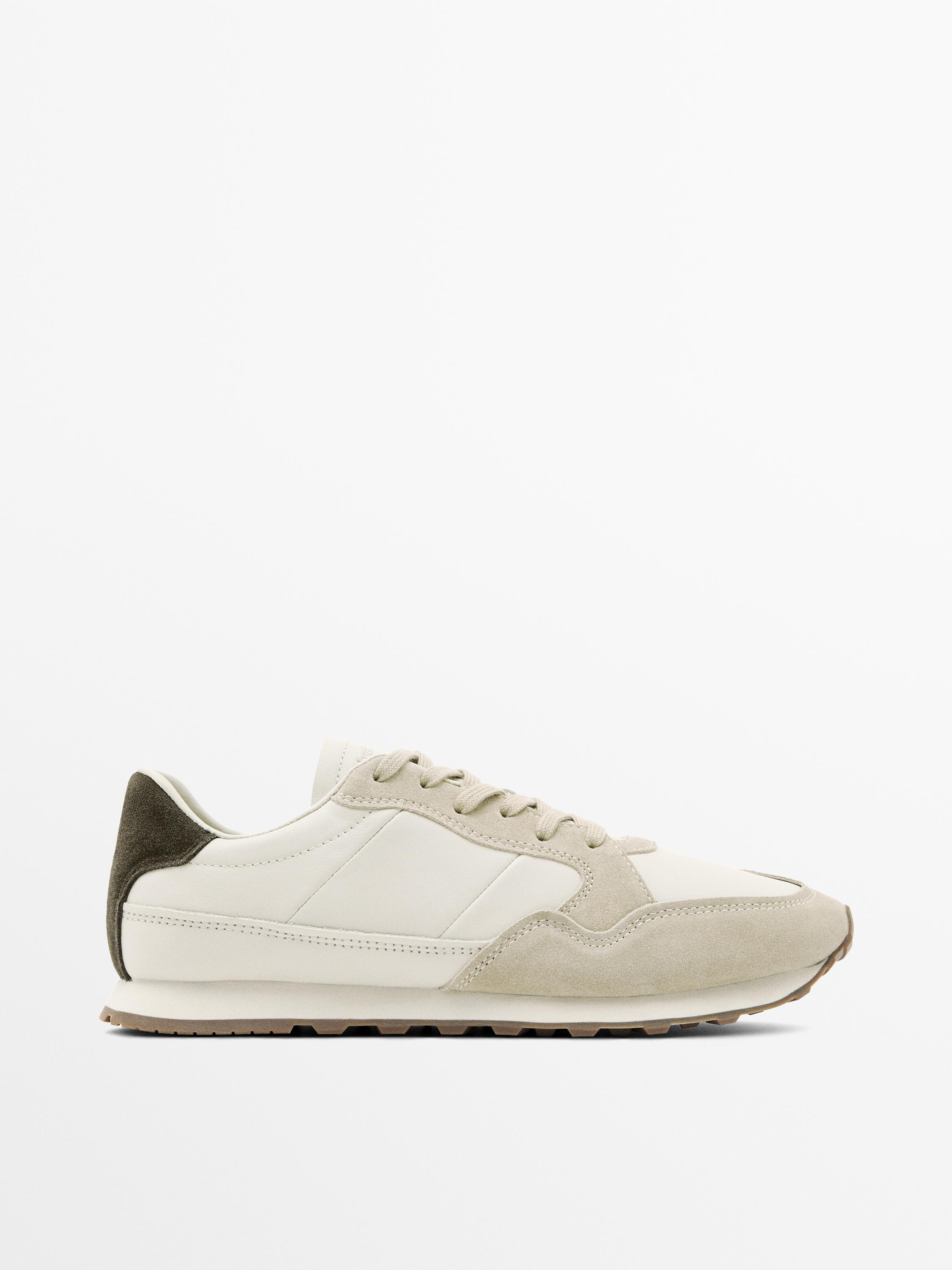 White sneaker with contrast heel piece and gum outsole