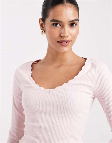 Knit rib button diagonal long sleeve top in pink