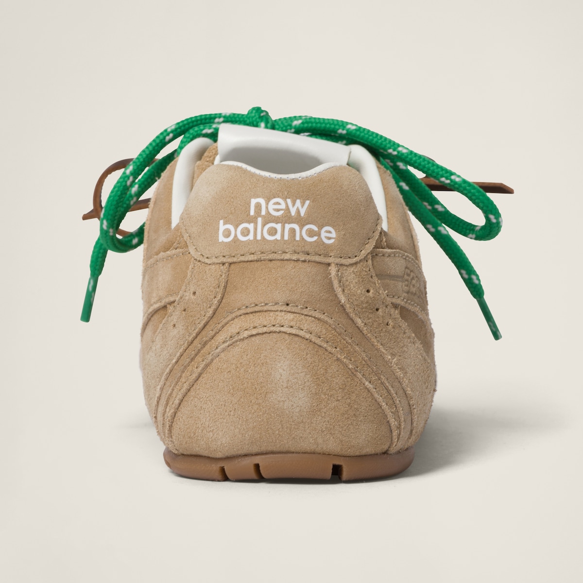 Top-down view showing the suede panels, NB logo and miu miu tongue tab