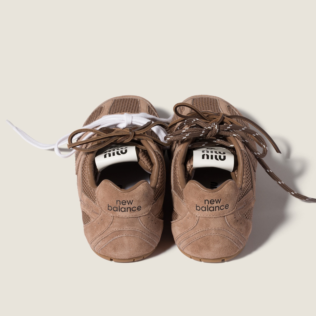 Detail of the suede-and-mesh upper, perforated toe and contrast laces