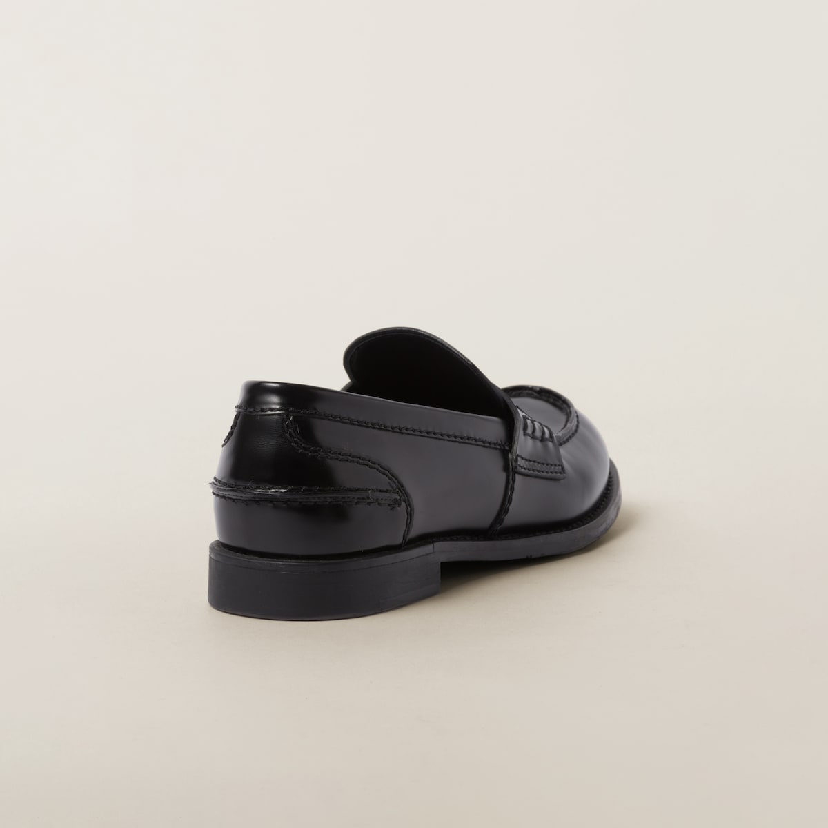Top-down view showing the moccasin stitch, penny strap and rounded toe