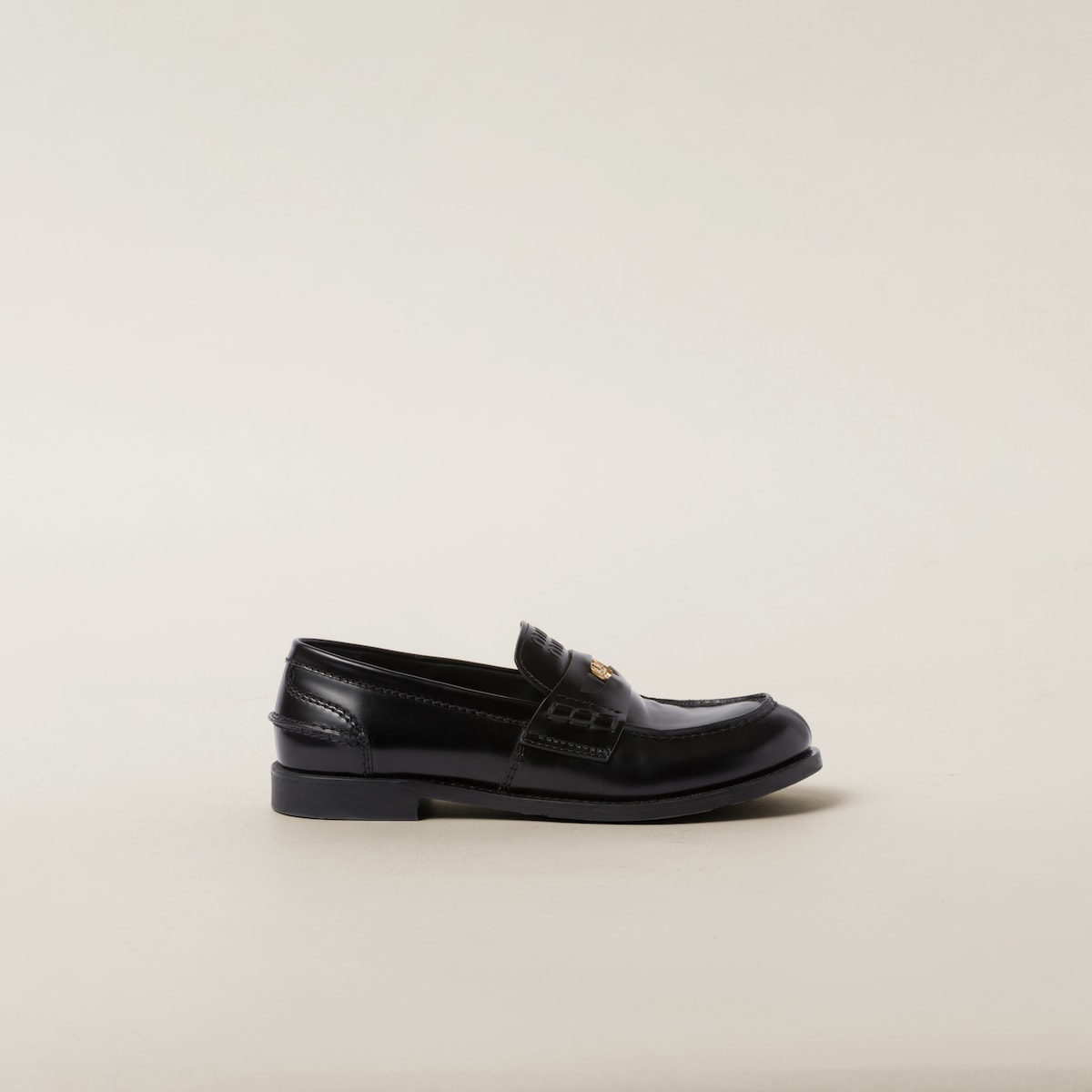 Side profile — the low block heel and stacked leather sole
