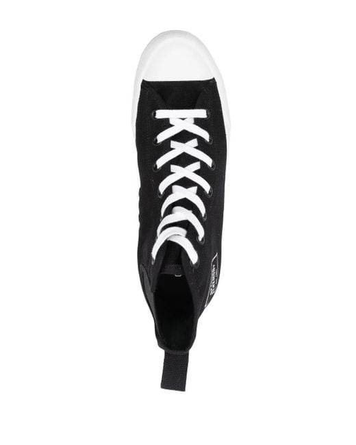 Top-down view highlighting the lace-up closure and white cap toe