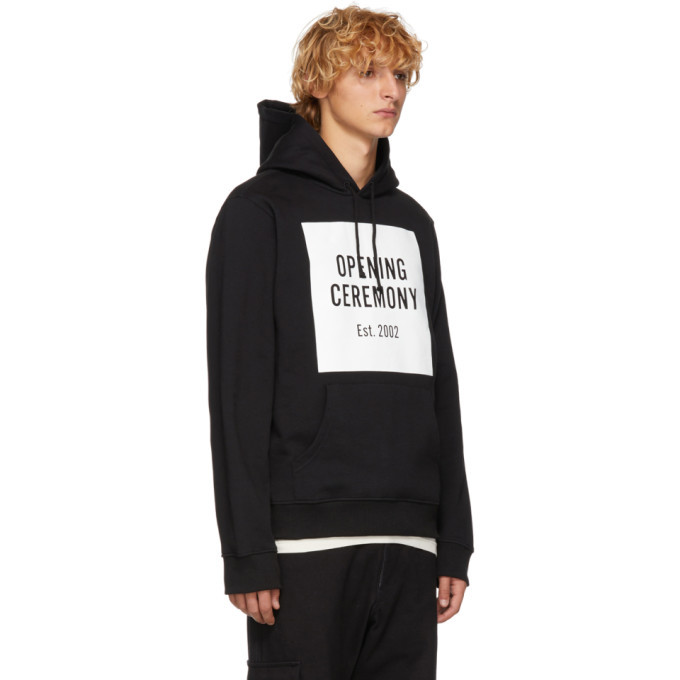 Black hoodie with a white logo panel and classic pullover shape